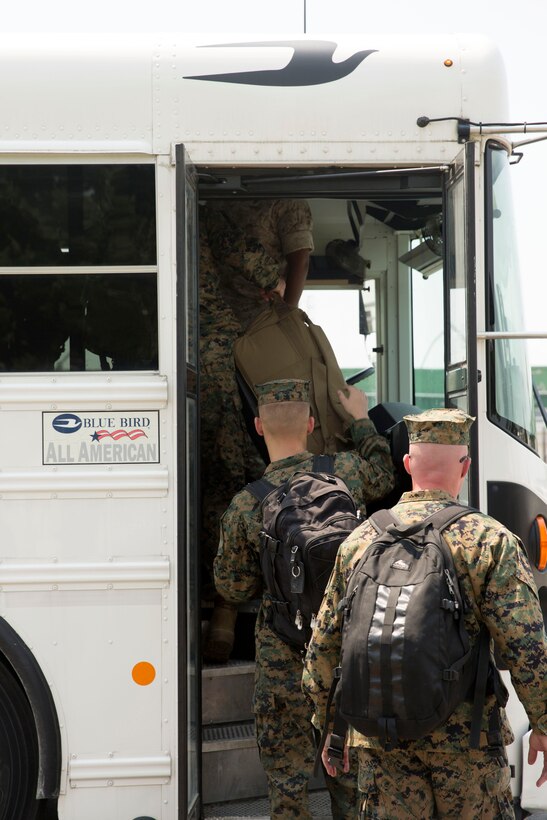 Marines with Marine Operational Test and Evaluation Squadron 22 load onto a bus to begin their trek to the unit’s first deployment, July 9. The Marine Corps Air Station New River Marines deployed to support Special Marine Air Ground Task Force-South aboard USS America on its maiden voyage. The USS America is the first amphibious assault ship of its class.