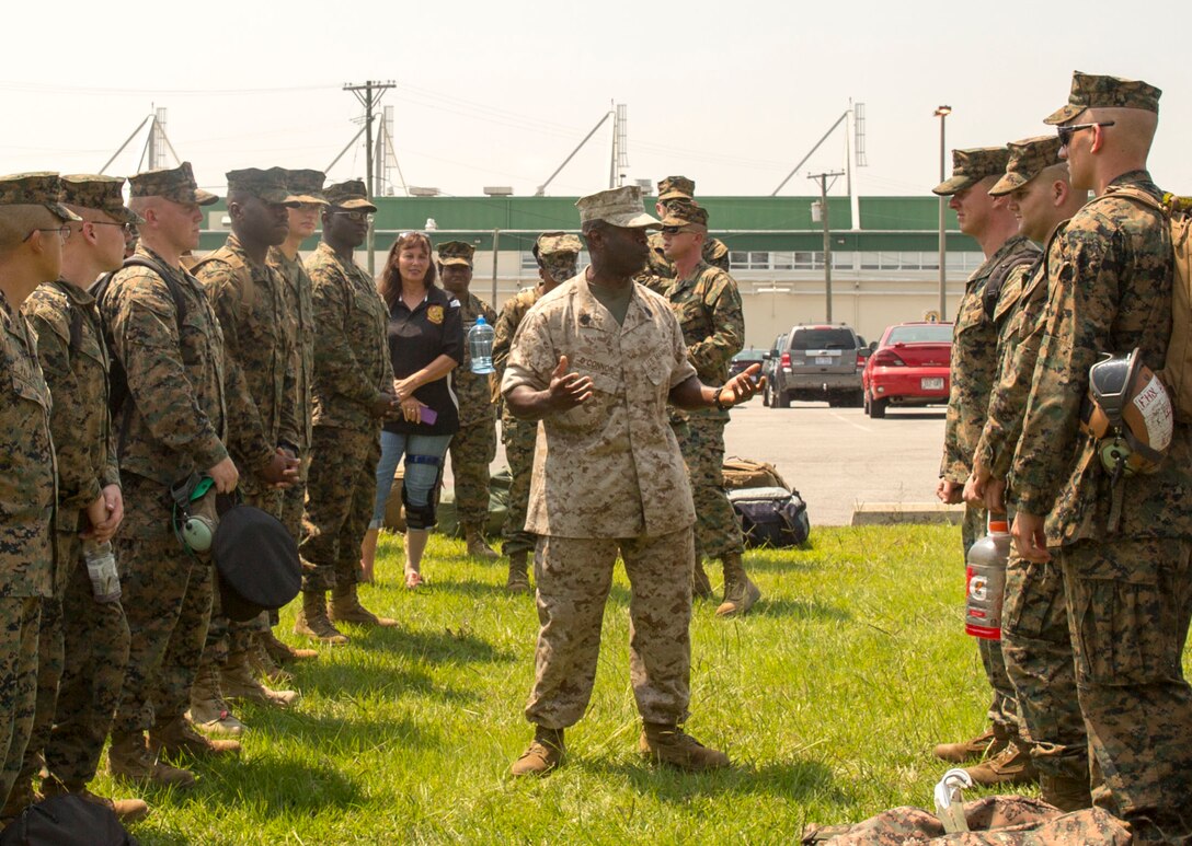 Sgt. Maj. Clive O'Connor, the sergeant major of Marine Operational Test and Evaluation Squadron 22, speaks to his Marines prior to the unit’s first deployment, July 9. The Marine Corps Air Station New River Marines deployed to support Special Marine Air Ground Task Force-South aboard USS America on its maiden voyage. O’Connor shared guidance with his troops, emphasizing the importance of safety.  