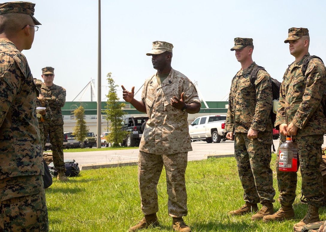 Sgt. Maj. Clive O'Connor, the sergeant major of Marine Operational Test and Evaluation Squadron 22, speaks to his Marines prior to the unit’s first deployment, July 9. The Marine Corps Air Station New River Marines deployed to support Special Marine Air Ground Task Force-South aboard USS America on its maiden voyage. O’Connor shared guidance with his troops, emphasizing the importance of safety.  