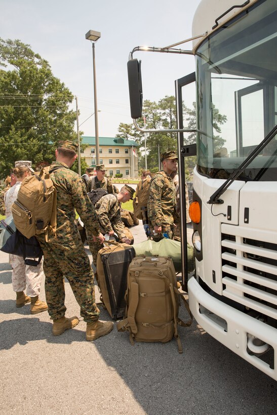 Marines with Marine Operational Test and Evaluation Squadron 22 load onto a bus to begin their trek to the unit’s first deployment, July 9. The Marine Corps Air Station New River Marines deployed to support Special Marine Air Ground Task Force-South aboard USS America on its maiden voyage. The USS America is the first amphibious assault ship of its class.