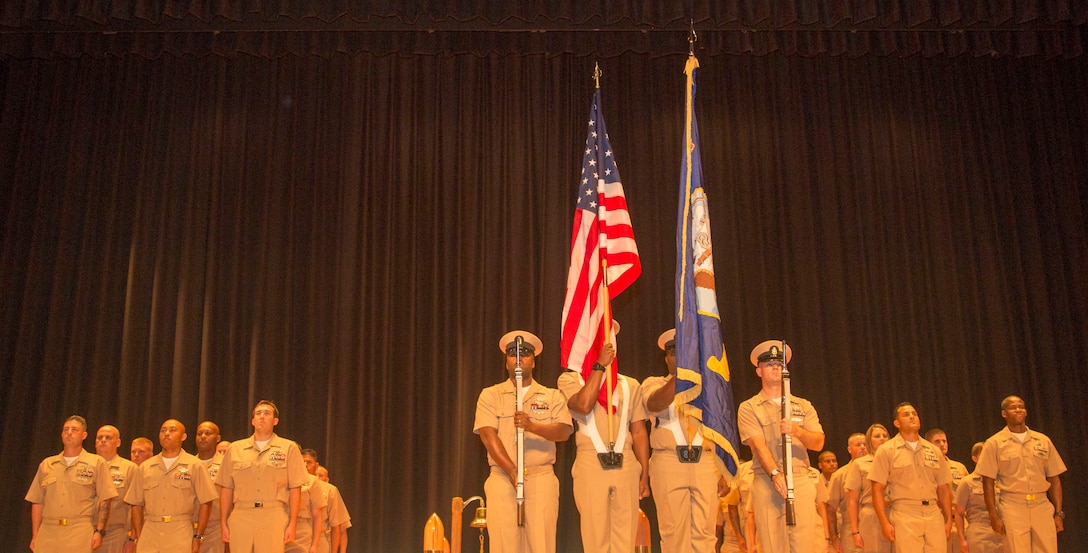 The color guard stands in front of Marine Corps Base Camp Lejeune’s newest chief petty officers at the opening of their induction ceremony, at the base theater aboard the Marine Corps Base Camp Lejeune, September 16. Twenty-two sailors from area units earned the promotion to E-7 after undergoing testing, a selection board and a six-week induction program.