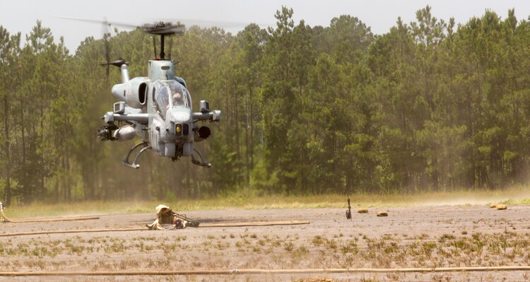 Marines with Marine Light Attack Helicopter Squadron 269 land an AH-1W Super Cobra helicopter during Forward Arming and Refueling Point exercises at Marine Corps Outlying Field Camp Davis, near Holly Ridge, N.C., July 8. Throughout the week the Marines with HLMA-269 filled and reloaded aircraft 18 times with 200 to 300 gallons of fuel each time.