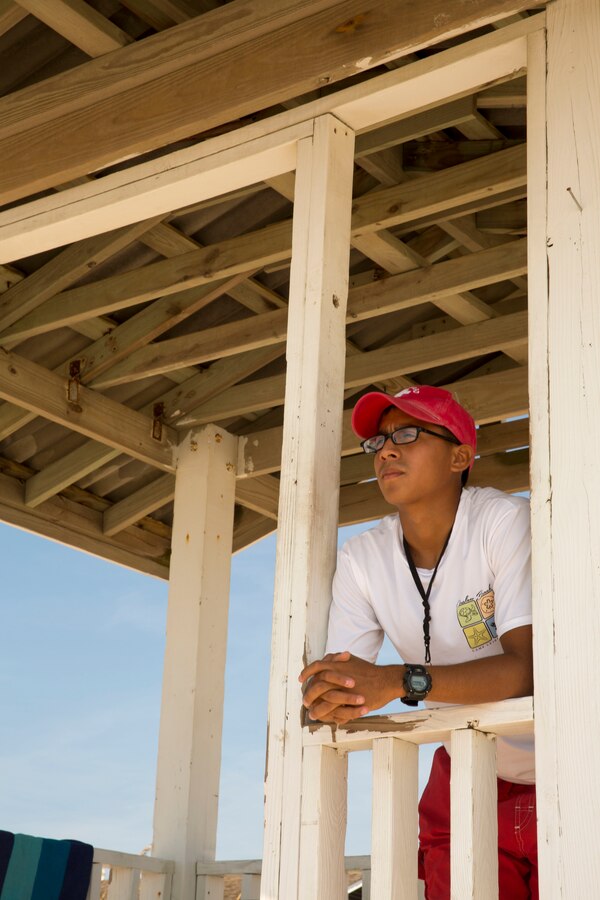 Cpl. Yorlin J. Barzola Ronquillo, a lifeguard with Headquarters Support Battalion’s Beach Detachment, watches over the shore of Onslow Beach aboard Marine Corps Base Camp Lejeune, August 28. The shores of the beach are guarded by 30 Marines who provide for the safety and cleanliness of the area annually, from Memorial Day to Labor Day