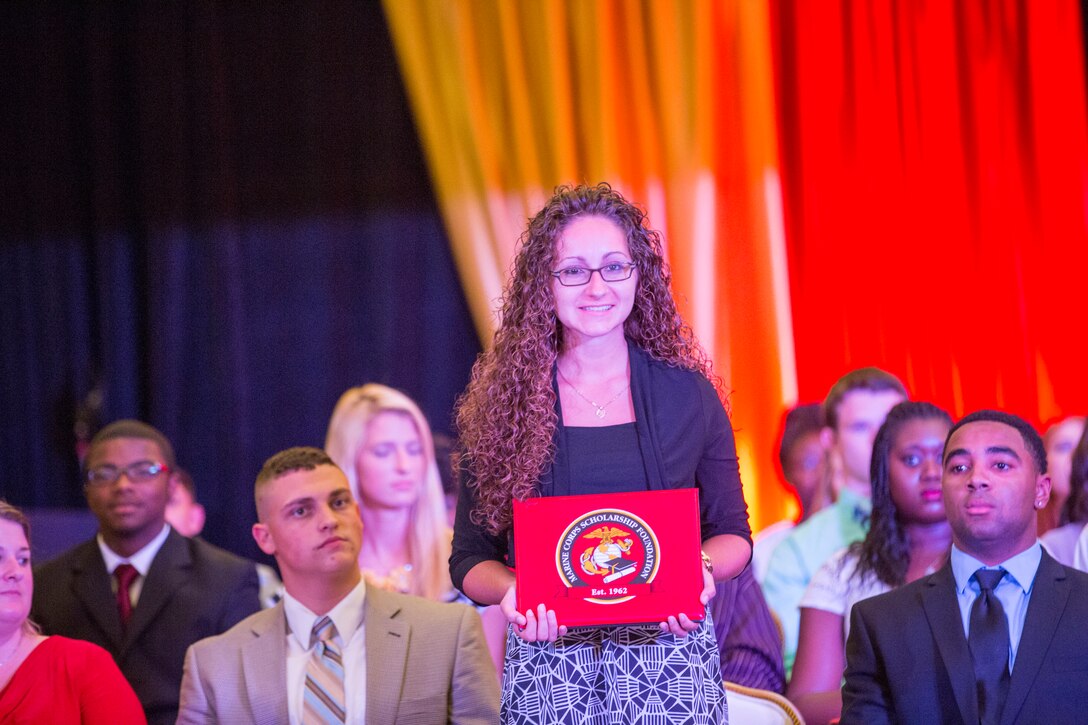 Seventy students and their families attended a Scholarship Announcement Ceremony hosted by the Marine Corps Scholarship Foundation at the Marston Pavilion aboard Marine Corps Base Camp Lejeune, July 18. Brig. Gen. John K. Love, the deputy commanding general of II Marine Expeditionary Force, and Eric Steimel, the principal of Lejeune High School, spoke during the event. The Marine Corps Scholarship Foundation awarded more than $6.59 million in scholarship funding to 2,194 Marine children for the 2014-15 academic year. Scholarship recipients are the children of Marines and Navy corpsmen. Marine Corps Scholarship Foundation is the oldest and largest provider of need-based scholarships. For more information, visit www.mcsf.org. 