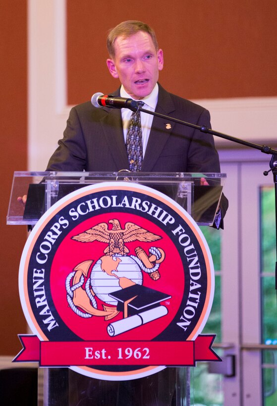 Steven Peterson, the chief operating officer of the Marine Corps Scholarship Foundation, speaks to guests during the foundations Scholarship Announcement Ceremony at Marston Pavilion aboard Marine Corps Base Camp Lejeune, Friday. Scholarship recipients and their families attended the ceremony where they recognized more than $6.59 million in scholarship funding provided to 2,194 military children for the 2014-15 academic year. For more information, visit www.mcsf.org.