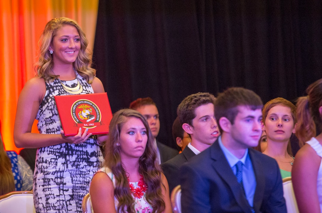 Seventy students and their families attended a Scholarship Announcement Ceremony hosted by the Marine Corps Scholarship Foundation at the Marston Pavilion aboard Marine Corps Base Camp Lejeune, July 18. Brig. Gen. John K. Love, the deputy commanding general of II Marine Expeditionary Force, and Eric Steimel, the principal of Lejeune High School, spoke during the event. The Marine Corps Scholarship Foundation awarded more than $6.59 million in scholarship funding to 2,194 Marine children for the 2014-15 academic year. Scholarship recipients are the children of Marines and Navy corpsmen. Marine Corps Scholarship Foundation is the oldest and largest provider of need-based scholarships. For more information, visit www.mcsf.org. 