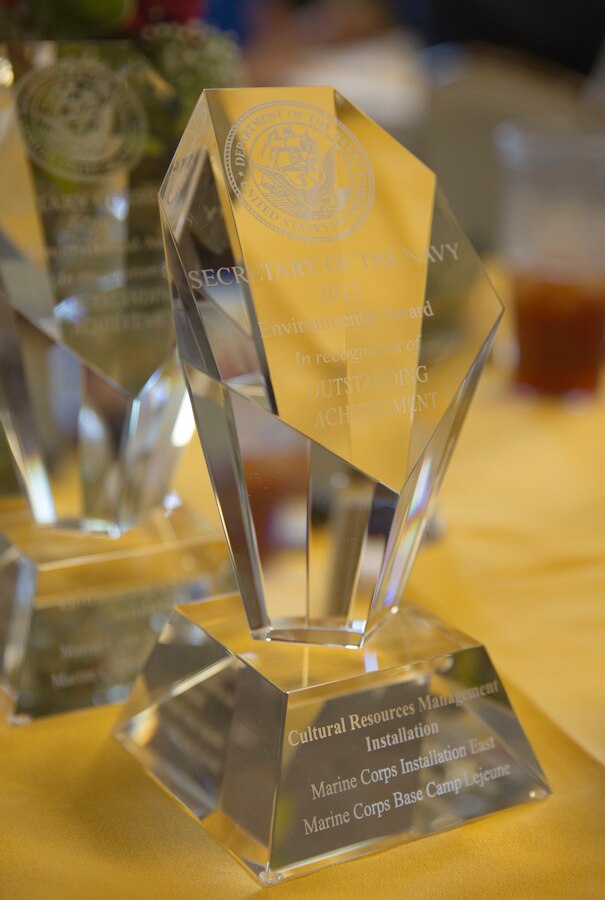 Trophies were presented to three groups within Environmental Management Division aboard Marine Corps Base Camp Lejeune recognizing their efforts to protect the area’s natural and historical resources throughout fiscal year 2013. The Environmental Restoration Program, Cultural Resources Management and Alicia Filzen, the winner for individual environmental quality, were presented the Secretary of the Navy Environmental Awards at the Officer’s Club aboard the base, Aug. 8.