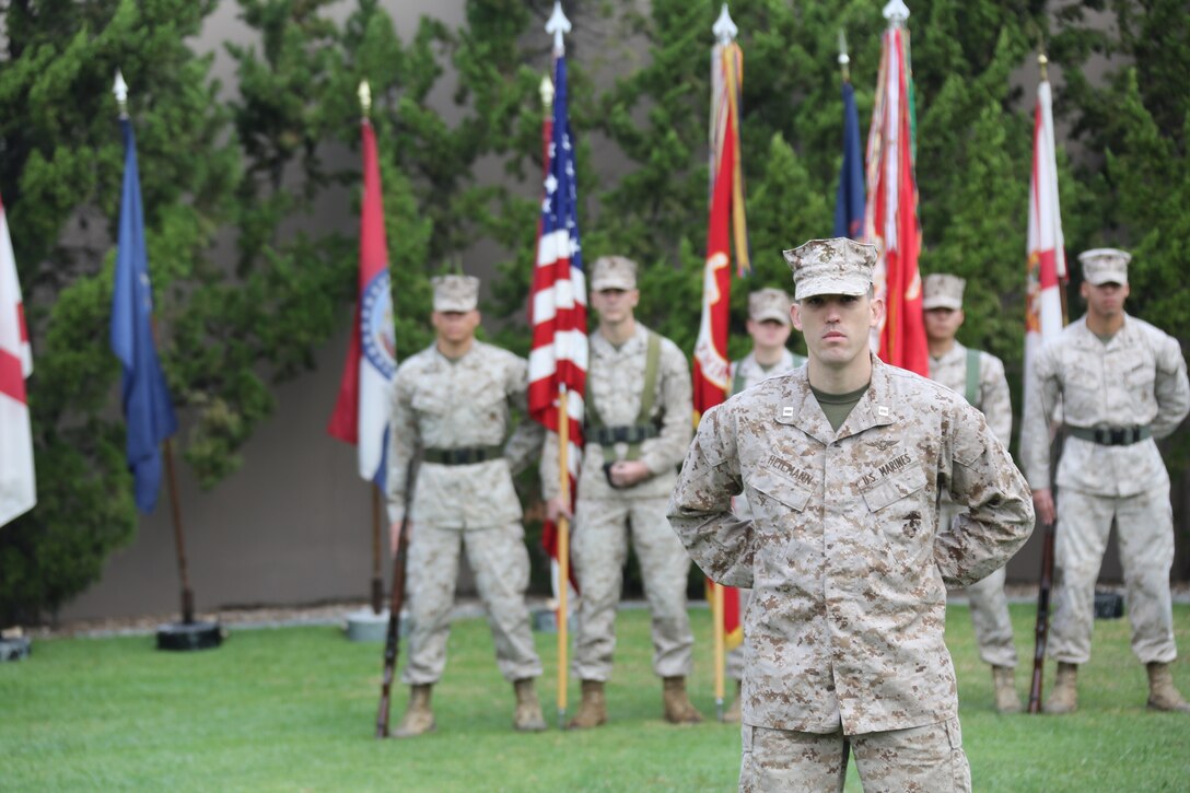 Capt. Ryan Heilmann, reviewing officer, stands in front of the color guard during a morning colors ceremony aboard Marine Corps Air Station Miramar, Calif., Dec. 9. The ceremony commemorated the deactivation of Marine Aircraft Group Afghanistan and the end of 3rd Marine Aircraft Wing’s involvement in Operation Enduring Freedom.