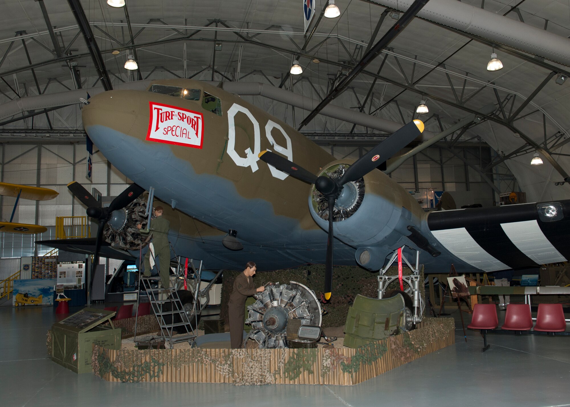 The C-47A Skytrain, the “Turf and Sport Special,” prominently sits on display Nov. 15, 2014, inside the Air Mobility Command Museum on Dover Air Force Base, Del. On D-Day, during the invasion of Normandy, this aircraft dropped paratroopers from the 82nd Airborne Division into St. Mere-Eglise, France. (U.S. Air Force photo/Airman 1st Class Zachary Cacicia)