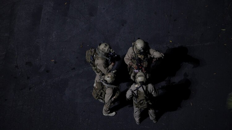 U.S. Marines with the 15th Marine Expeditionary Unit’s Maritime Raid Force discuss the next stage in a raid at Dodger Stadium during realistic urban training in Los Angeles Dec. 8, 2014. RUT prepares the 15th MEU Marines for their upcoming deployment, enhancing their combat skills in environments similar to those they may find in future missions. (U.S. Marine Corps photo by Staff Sgt. Miguel Carrasco/Released)
