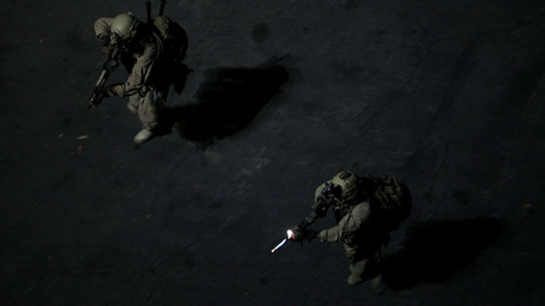 U.S. Marines with the 15th Marine Expeditionary Unit’s Maritime Raid Force approach a breaching point at Dodger Stadium during realistic urban training in Los Angeles Dec. 8, 2014. RUT prepares the 15th MEU Marines for their upcoming deployment, enhancing their combat skills in environments similar to those they may find in future missions. (U.S. Marine Corps photo by Staff Sgt. Miguel Carrasco/Released)