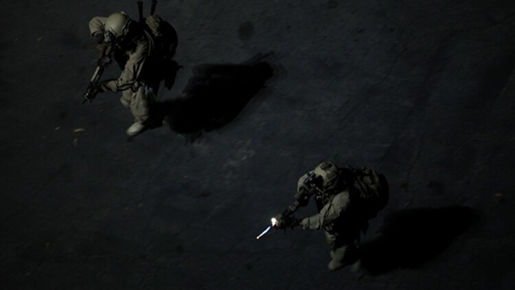 U.S. Marines with the 15th Marine Expeditionary Unit’s Maritime Raid Force approach a breaching point at Dodger Stadium during realistic urban training in Los Angeles Dec. 8, 2014. RUT prepares the 15th MEU Marines for their upcoming deployment, enhancing their combat skills in environments similar to those they may find in future missions. (U.S. Marine Corps photo by Staff Sgt. Miguel Carrasco/Released)