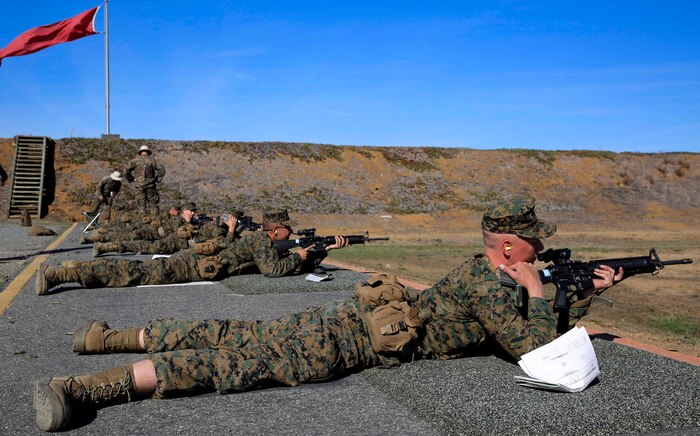 Recruits of Kilo Company, 3rd Recruit Training Battalion, aim in at the target in the prone position from the 500-yard line at Edson Range, Weapons and Field Training Battalion, Marine Corps Base Camp Pendleton, Calif., Nov. 24. Recruits are required to fire the 200, 300 and 500-yard lines in order to qualify.