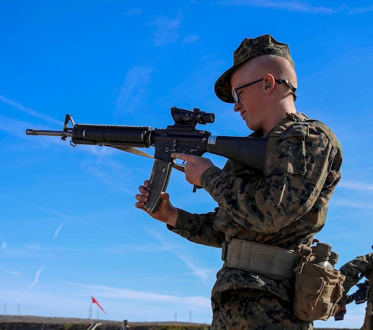 Recruit Jared C. Seeland, Platoon 3229, Kilo Company, 3rd Recruit Training Battalion, reloads his M16-A4 Service Rifle in the standing position during rifle week at Edson Range, Weapons and Field Training Battalion, Marine Corps Base Camp Pendleton, Calif., Nov. 24. During Firing Week, recruits apply the basic fundamental marksmanship principles they learned to qualify with their weapon and be able to move forward with training