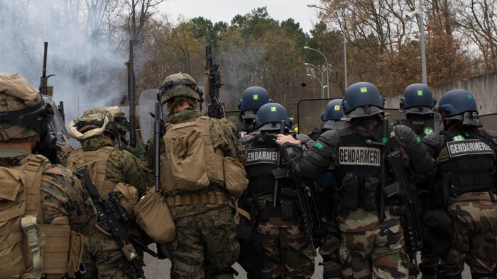U.S. Marines with SPMAGTF Crisis Response – Africa and Police with Mobile Gendarmeries Armored Group and practice crowd and riot control techniques on National Center for Training of Police Forces of France, St. Astier, France, Dec 2, 2014.  The training enhanced mission readiness and help build relationships between the two militaries. 