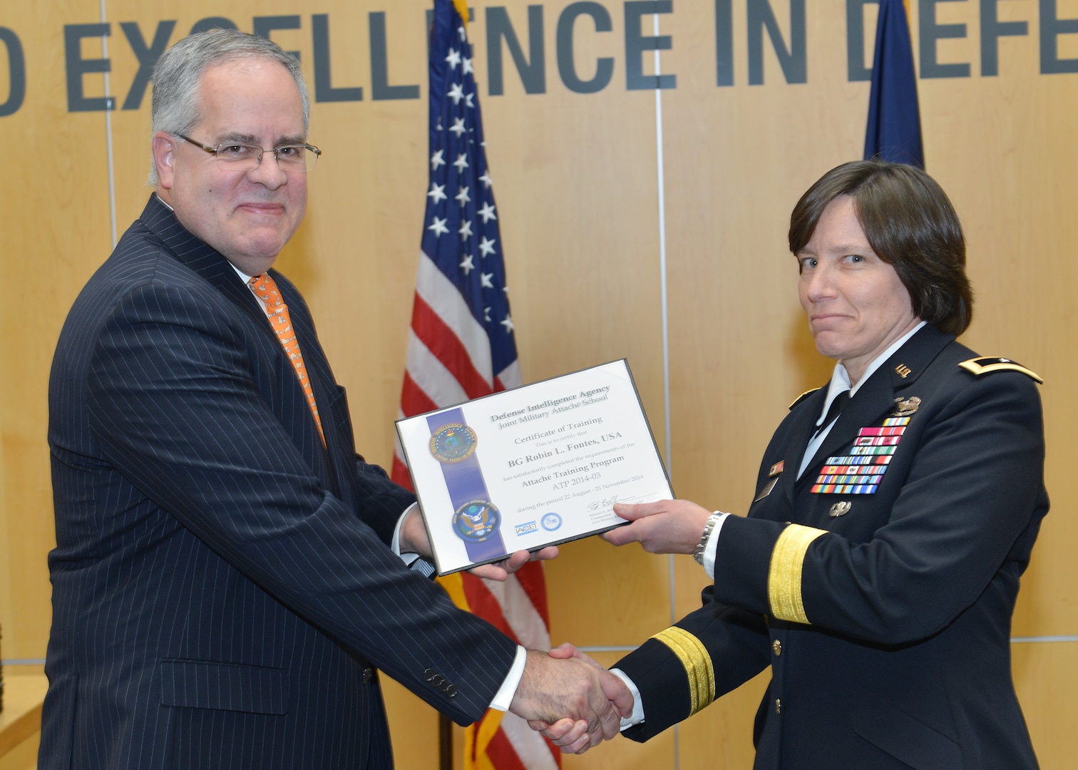 DIA Acting Director David Shedd presents Army Brig. Gen. Robin Fontes with her graduation certificate from the Joint Military Attaché School. Fontes will be the first female attaché assigned to India and the first general officer to serve as an attaché in India since the 1960s. 