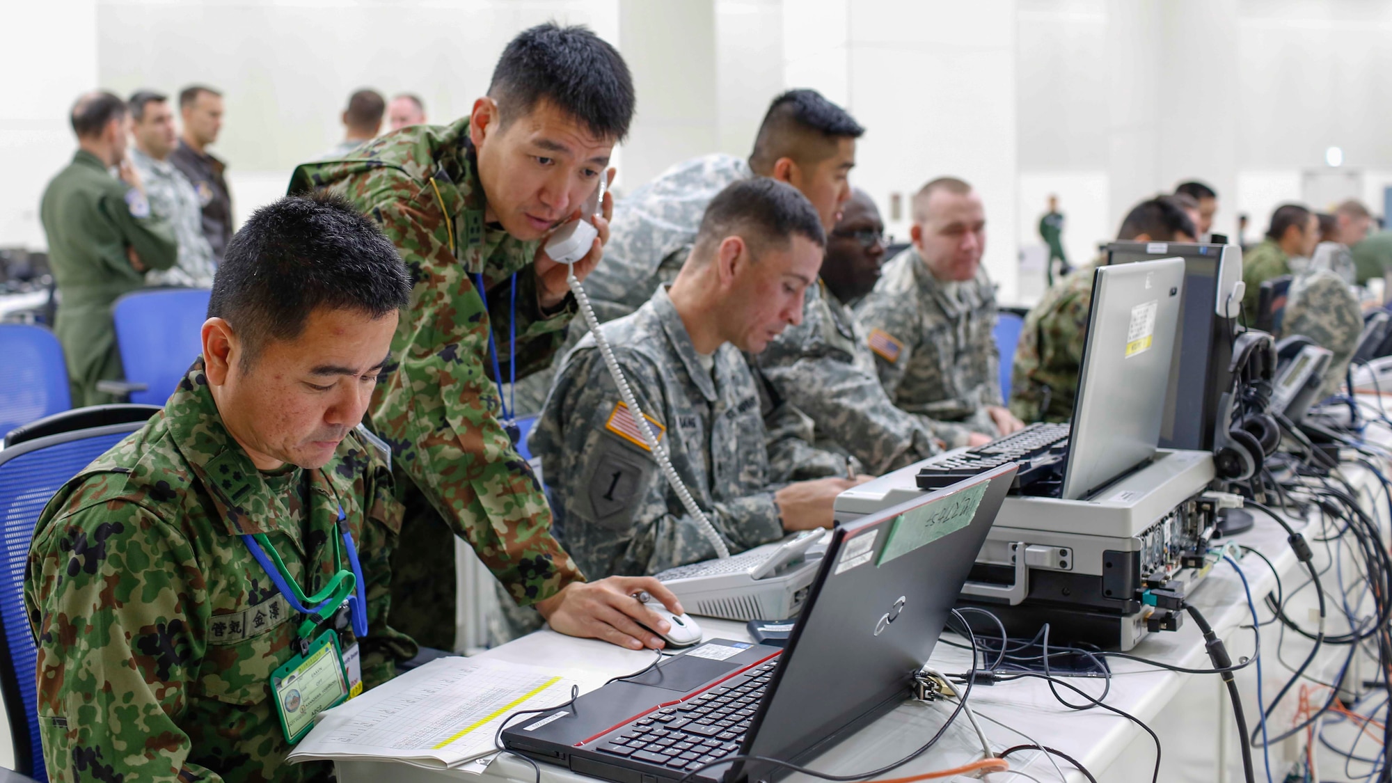 A group of Japan Ground Self-Defense Force Soldiers and U.S. Army Soldiers prepare for the Yama Sakura 67 exercise at Yokota Air Base, Japan, Dec. 8, 2014.  Yama Sakura is the largest U.S. Army bilateral exercise in the Asia-Pacific region.  (U.S. Air Force photo by Airman 1st Class Soo C. Kim / Released)