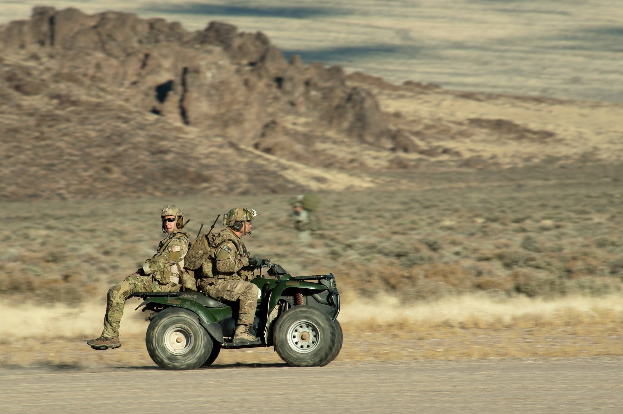 Joint Terminal Attack Controllers drive down a degraded airfield during the U.S. Air Force Weapons School's Joint Forcible Entry Exercise 14B at the Nevada Test and Training Range Dec. 6, 2014. A JTAC’s job is to translate the ground commander's needs into tactical directions over the radio that aircrews can understand. (U.S. Air Force photo by Senior Airman Timothy Young)