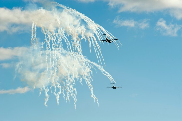 U.S. Air Force C-17 Globemaster IIIs assigned to March Air Reserve Base, Calif., deploy flares shortly after dropping paratroopers during the U.S. Air Force Weapons School's Joint Forcible Entry Exercise 14B over the Nevada Test and Training Range Dec. 6, 2014. The Globemaster’s four engines can each put out approximately 40,000 pounds of thrust. (U.S. Air Force photo by Senior Airman Timothy Young)