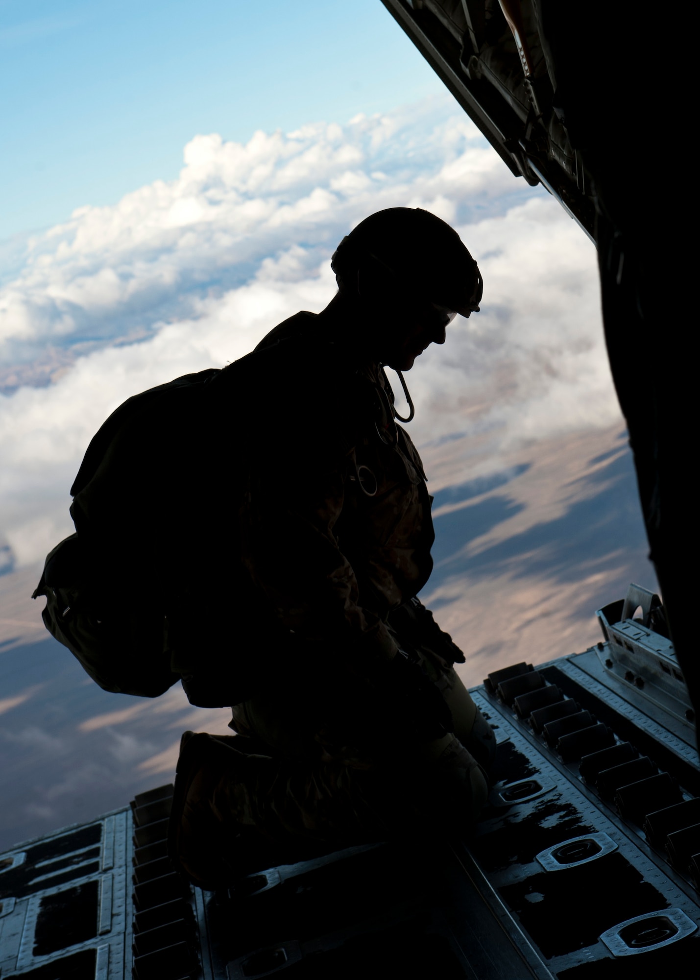 A U.S. Army Long Range Surveillance Paratrooper prepares to make a High Altitude Low Opening jump from a C-130J Hercules during the U.S. Air Force Weapons School's Joint Forcible Entry Exercise 14B over the Nevada Test and Training Range Dec. 4, 2014. JFEX is the weapons school’s large-scale air mobility exercise in which participants plan and execute a complex air-land operation in a simulated contested battlefield. (U.S. Air Force photo by Senior Airman Thomas Spangler)