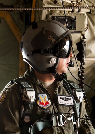 Master Sgt. Francesco Ventura, a C-130J Hercules loadmaster assigned to the 29th Weapons Squadron from Little Rock Air Force Base, Ark., lowers the ramp of a C-130J Hercules for U.S. Army paratroopers to make a static-line jump during the U.S. Air Force Weapons School's Joint Forcible Entry Exercise 14B over the Nevada Test and Training Range Dec. 4, 2014. In addition to supervising the loading and unloading of cargo, loadmasters are involved with air delivery operations that use parachutes to deliver supplies, equipment and troops. (U.S. Air Force photo by Senior Airman Thomas Spangler)