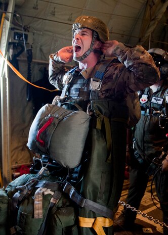 U.S. Army Paratrooper 1st Lt. Tom Minor, 3rd Long Range Surveillance Detachment Platoon Leader and ground force commander, sounds off for equipment checks before performing a static-line jump during the U.S. Air Force Weapons School's Joint Forcible Entry Exercise 14B over the Nevada Test and Training Range, Dec. 4, 2014. Once into position on the ground, the paratroopers took pictures of surface to air missiles and reported viable intelligence to Army and Air Force commanders. (U.S. Air Force photo by Senior Airman Thomas Spangler)