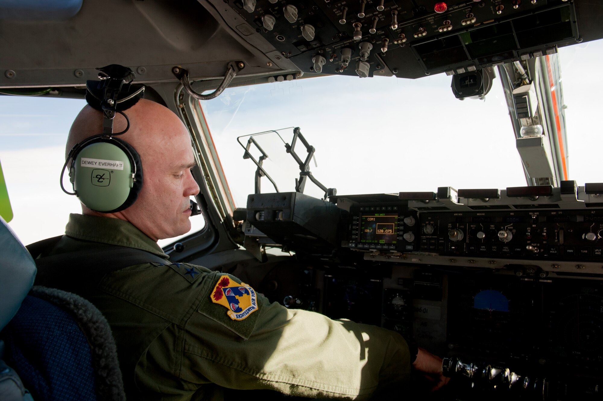 Lt. Gen. Carlton Everhart, 18th Air Force commander, pilots a C-17 Globemaster III en route to the Nevada Test and Training Range during the U.S. Air Force Weapons School's Joint Forcible Entry Exercise 14B Dec. 6, 2014. JFEX is a U.S. Air Force Weapons School large-scale air mobility exercise that tests participants’ ability to synchronize aircraft movements from geographically separated bases. (U.S. Air Force photo by Senior Airman Thomas Spangler)