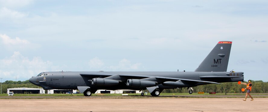 A U.S. Air Force B-52 Stratofortress bomber, deployed to Anderson Air Force Base, Guam, from Minot Air Force Base, N.D., lands at Royal Australian Air Force Base Darwin, Australia, Dec. 8, 2014. The aircraft operates out of Andersen as part of U.S. Pacific Command and U.S. Air Force rotational presence in the Pacific. This is the fourth time a B-52 has landed at RAAF Darwin since 2012 and will enhance the United States’ ability to train, exercise and operate with Australia and other partners across the region. (Royal Australian Navy photo by ABIS Nicolas Gonzalez/Released)