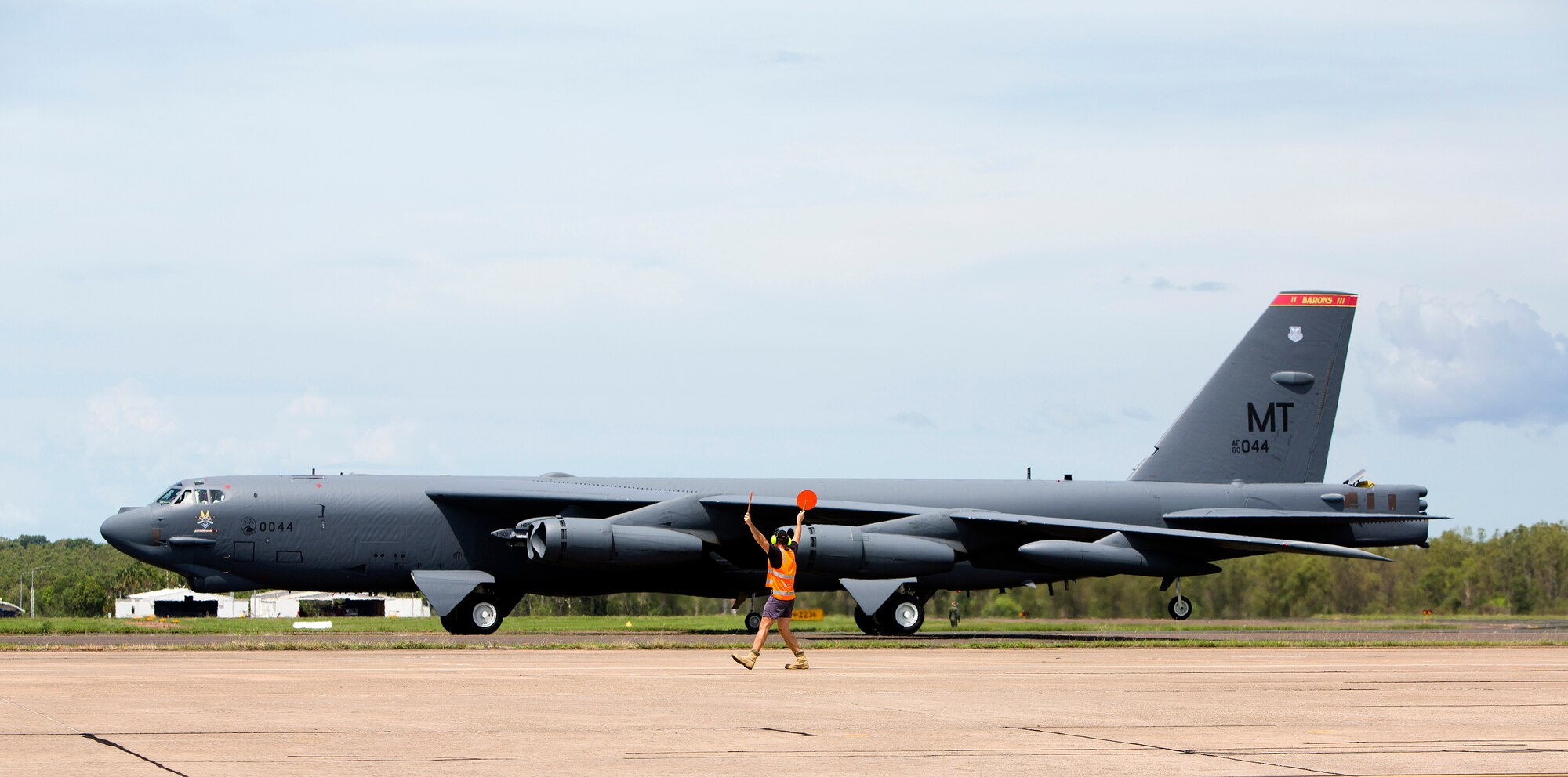 A U.S. Air Force B-52 Stratofortress bomber, deployed to Anderson Air Force Base, Guam, from Minot Air Force Base, N.D., lands at Royal Australian Air Force Base Darwin, Australia, Dec. 8, 2014. The aircraft operates out of Andersen as part of U.S. Pacific Command and U.S. Air Force rotational presence in the Pacific. This is the fourth time a B-52 has landed at RAAF Darwin since 2012 and will enhance the United States’ ability to train, exercise and operate with Australia and other partners across the region. (Royal Australian Navy photo by ABIS Nicolas Gonzalez/Released)