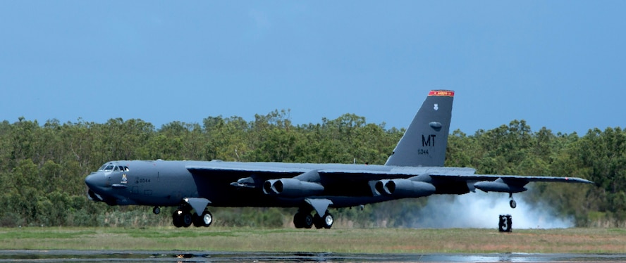 A U.S. Air Force B-52 Stratofortress bomber, deployed to Anderson Air Force Base, Guam, from Minot Air Force Base, N.D., lands at Royal Australian Air Force Base Darwin, Australia, Dec. 8, 2014. The aircraft operates out of Andersen as part of U.S. Pacific Command and U.S. Air Force rotational presence in the Pacific. This is the fourth time a B-52 has landed at RAAF Darwin since 2012 and will enhance the United States’ ability to train, exercise and operate with Australia and other partners across the region. (Royal Australian Navy photo by ABIS Nicolas Gonzalez/Released)