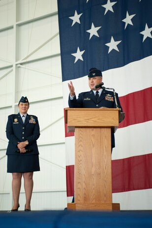 Col. Ross Anderson, 926th Wing commander, speaks to the crowd as Maj. Mckay Kingry, 926th WG inspector general, watches during the wing’s activation ceremony Dec. 5, 2014, at Nellis Air Force Base, Nev. The 926th WG includes more than 1,300 reservists integrated with active duty Air Force units at six geographically separated locations consisting of 13 squadrons. (U.S. Air Force photo by Senior Airman Timothy Young)