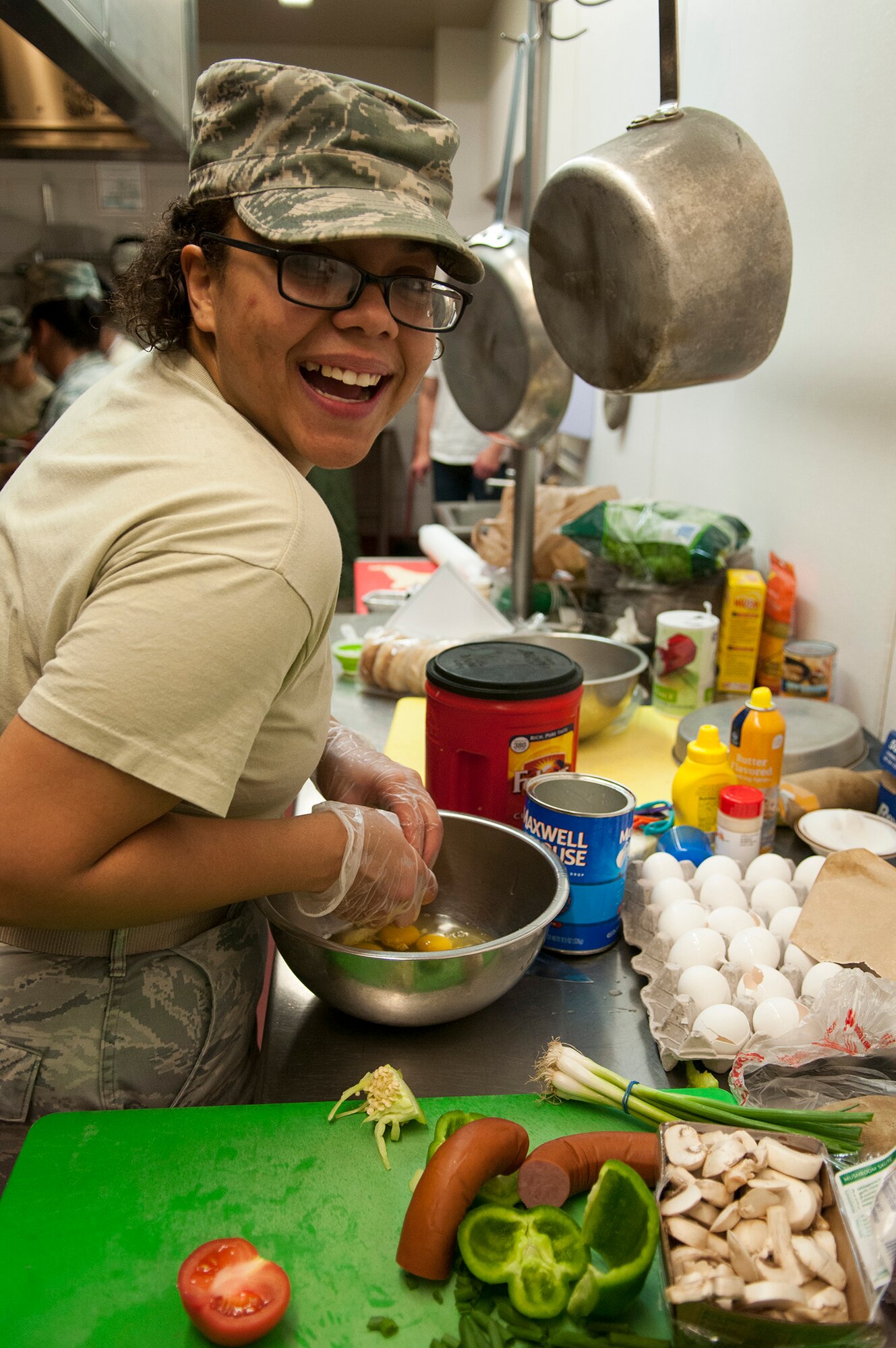 Senior Airman Brittany Booker, 341st Force Support Squadron missile chef, prepares eggs for a quiche Dec. 4 during the Fourth Quarter Warrior Chef Competition at the Elkhorn Dining Facility. Warrior Chef teams had seventy minutes to plan and prepare dishes using only provided groceries that were kept secret until the start of the competition. (U.S. Air Force photo/Tech. Sgt. Christina Perchine)