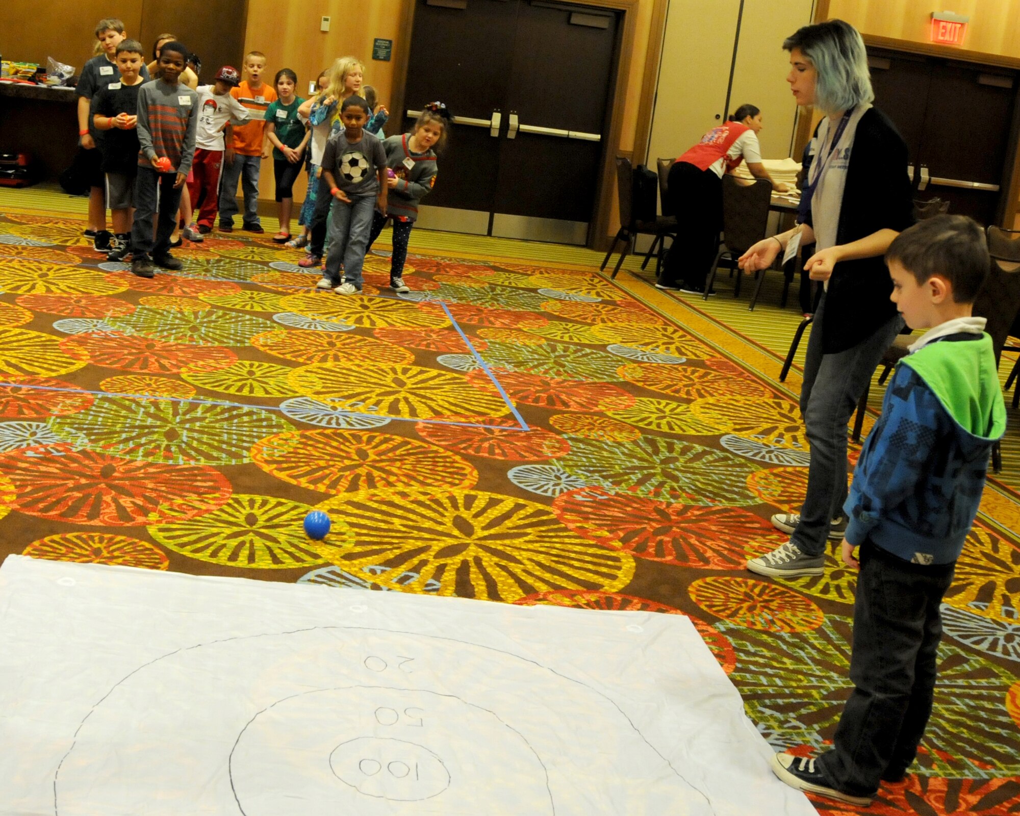 Elijah Hanlon (right) keeps score for his team during a game at an Air Force Reserve Yellow Ribbon Program training weekend Nov. 21-23 in Orlando, Florida. The 6-year-old is the son of Tech. Sgt. Bradley Hanlon, 73rd Aerial Port Squadron, Naval Air Station Fort Worth Joint Reserve Base, Texas. Yellow Ribbon is designed to help provide reservists and their loved ones access to resources before and after deployments. (U.S. Air Force photo by Master Sgt. Shanda De Anda)