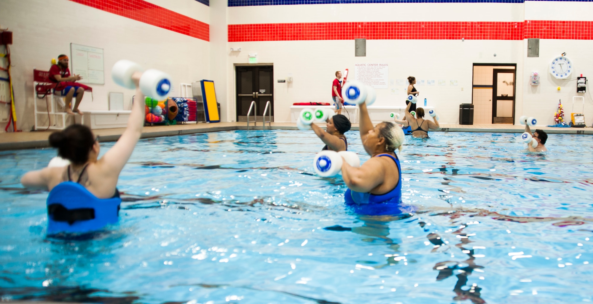 Military members and retirees participate in a water aerobics class on Joint Base Elmendorf-Richardson, Alaska, Dec. 3, 2014. During the class, the instructor incorporates exercise equipment such as water noodles, boogie boards, webbed water gloves, and water weights. (U.S. Air Force photo/Airman 1st Class Tammie Ramsouer)