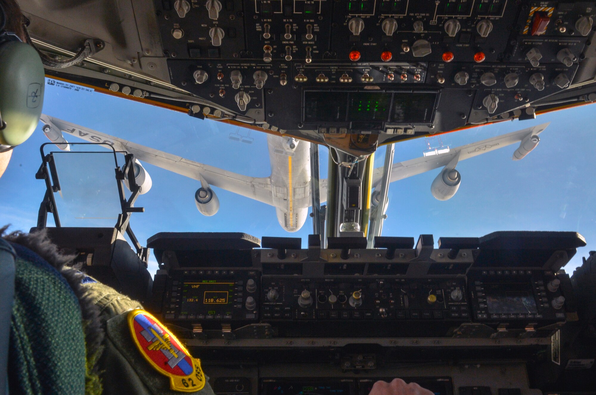 Capt. Josh Hughes, 62nd Operations Support Squadron aircrew flight equipment flight commander, positions a C-17 Globemaster III aircraft behind a KC-135 Stratotanker aircraft from Fairchild Air Force Base’s 92nd Air Refueling Wing Dec. 6, 2014, before a joint forcible entry exercise near the Keno drop zone, Nev. The air refueling was the final event of the simulated Rainier War before the jets made their way to participate in the JFE. (U.S. Air Force photo/Staff Sgt. Russ Jackson)