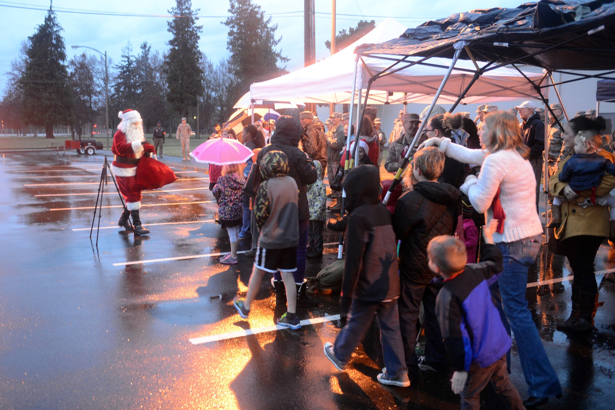 Santa Claus, North Pole commander, meets the families of Team McChord Dec. 8, 2014, during the McChord Field Annual Tree Lighting ceremony at Joint Base Lewis-McChord, Wash.  Santa Claus comes to Joint Base Lewis-McChord every year to take photos and ask children what they want for Christmas. (U.S. Air Force photo/Airman 1st Class Keoni Chavarria)