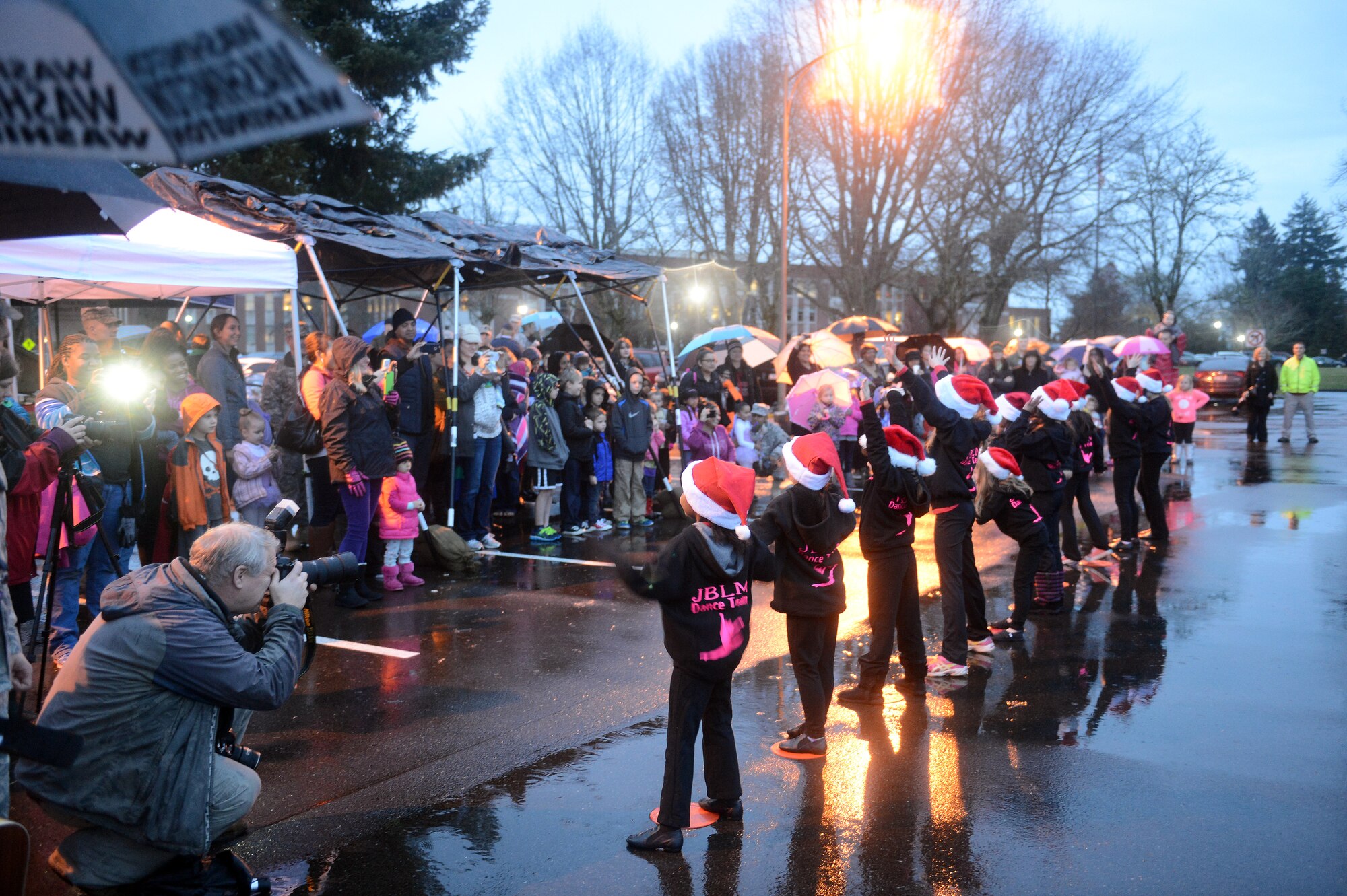 Dancers from the Joint Base Lewis-McChord dance team perform for the audience Dec. 8, 2014, during the McChord Field Annual Tree Lighting ceremony at Joint Base Lewis-McChord, Wash. The dance team entertained the crowd with a few acts to Christmas music. (U.S. Air Force photo/Airman 1st Class Keoni Chavarria)