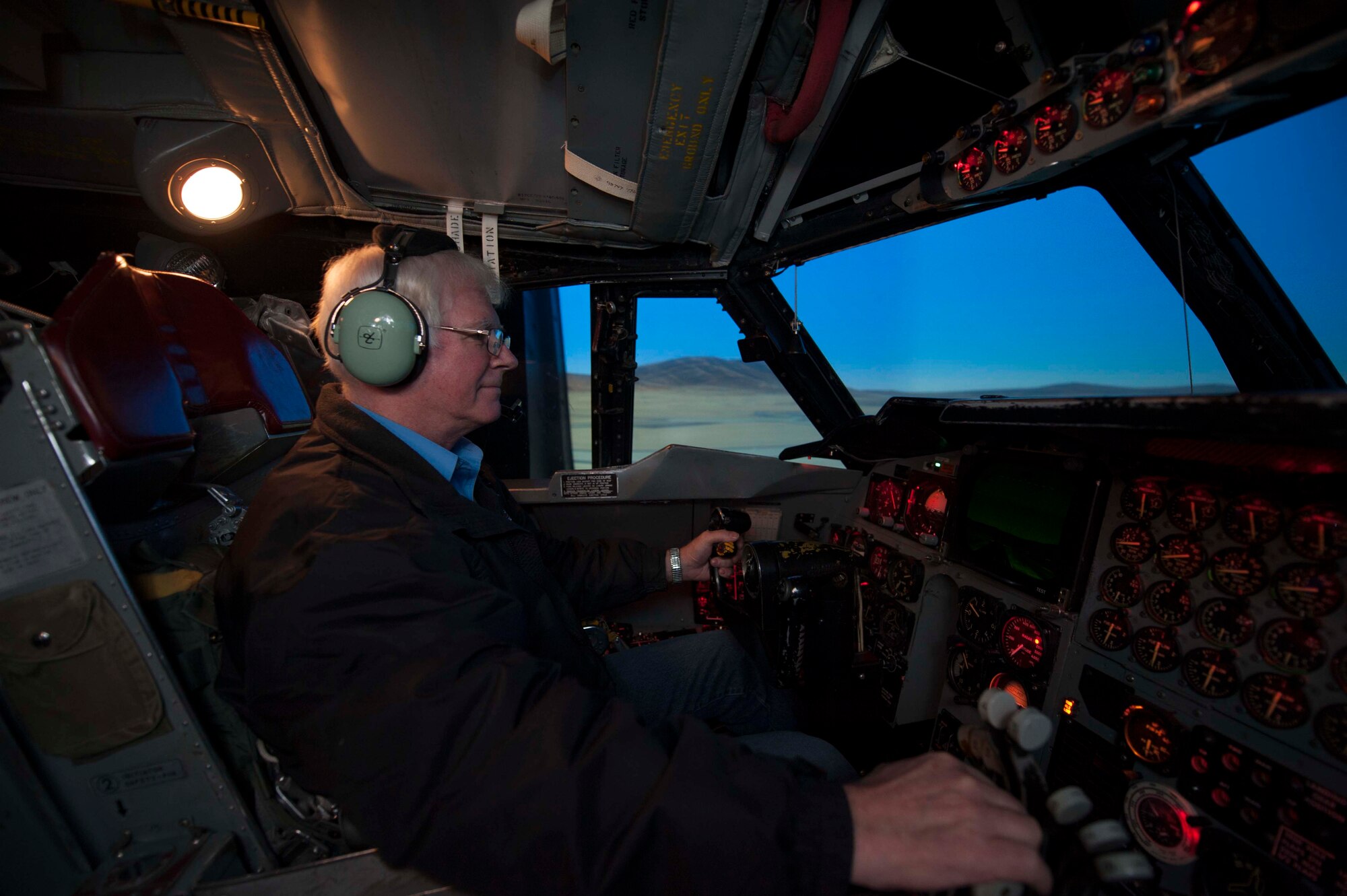 Doug Shroyer, 5th Operations Support Squadron contractor and system operator, pilots the B52-H Stratofortress weapons system trainer during a simulated flight on Minot Air Force Base, N.D., Dec. 3, 2014. New capabilities for conducting missions in the weapons system trainer are now complemented by the ability to record every action taken or word said during a scenario. (U.S. Air Force photo/Senior Airman Stephanie Morris)
