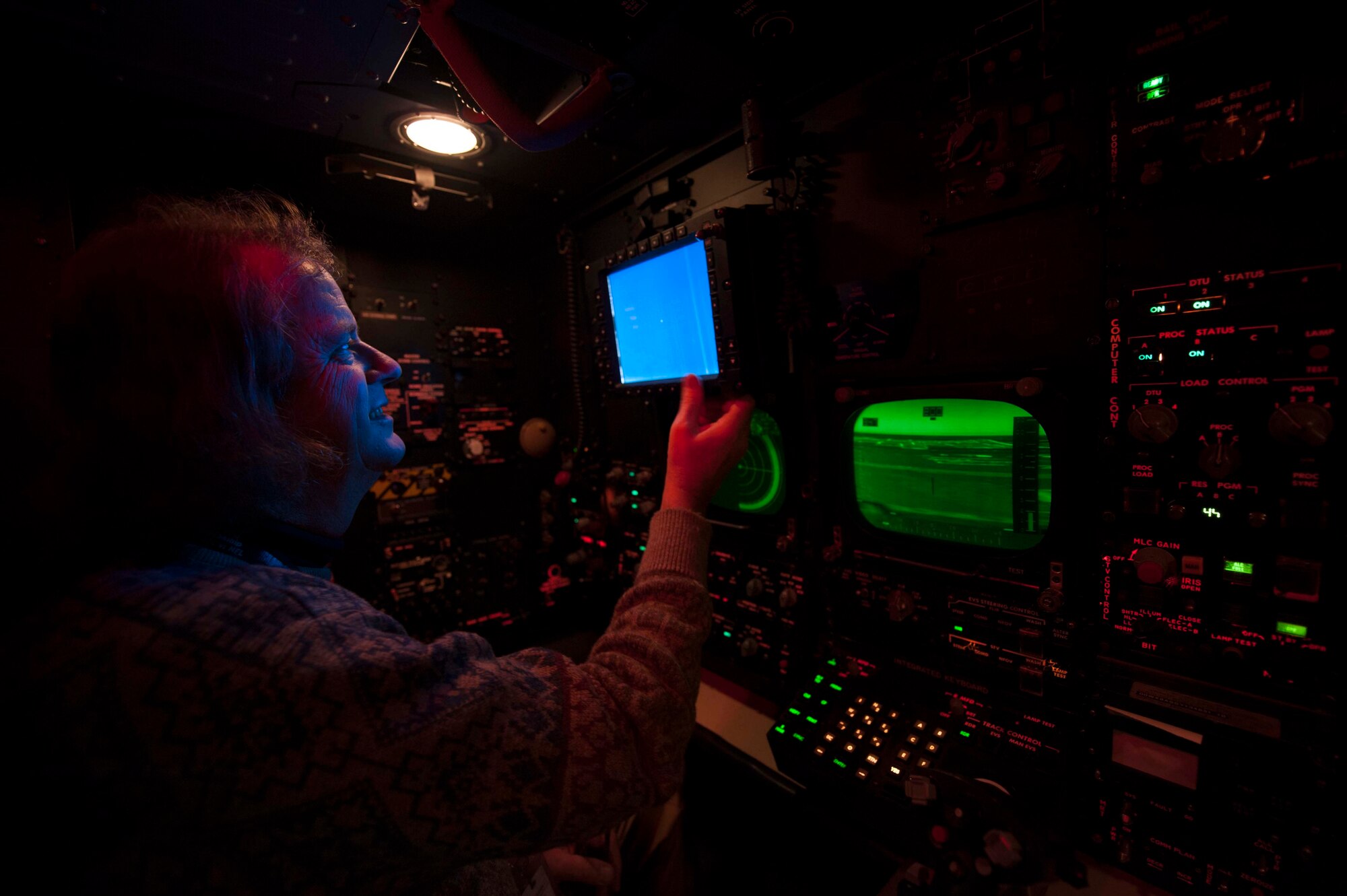 James Wuensch, 5th Operations Support Squadron contractor and system operator, adjusts a screen in the navigator simulator on Minot Air Force Base, N.D., Dec. 3, 2014. The navigator simulator is located next to the B52-H Stratofortress weapons system trainer and allows flight crews to simulate combat scenarios and prepare for real world combat. (U.S. Air Force photo/Senior Airman Stephanie Morris)