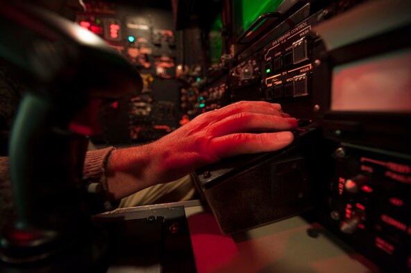 Adjustments are made to the navigator simulator on Minot Air Force Base, N.D., Dec. 3, 2014. The navigator simulator is located next to the B52-H Stratofortress weapons system trainer and allows flight crews to simulate combat scenarios and prepare for real world combat. (U.S. Air Force photo/Senior Airman Stephanie Morris)
