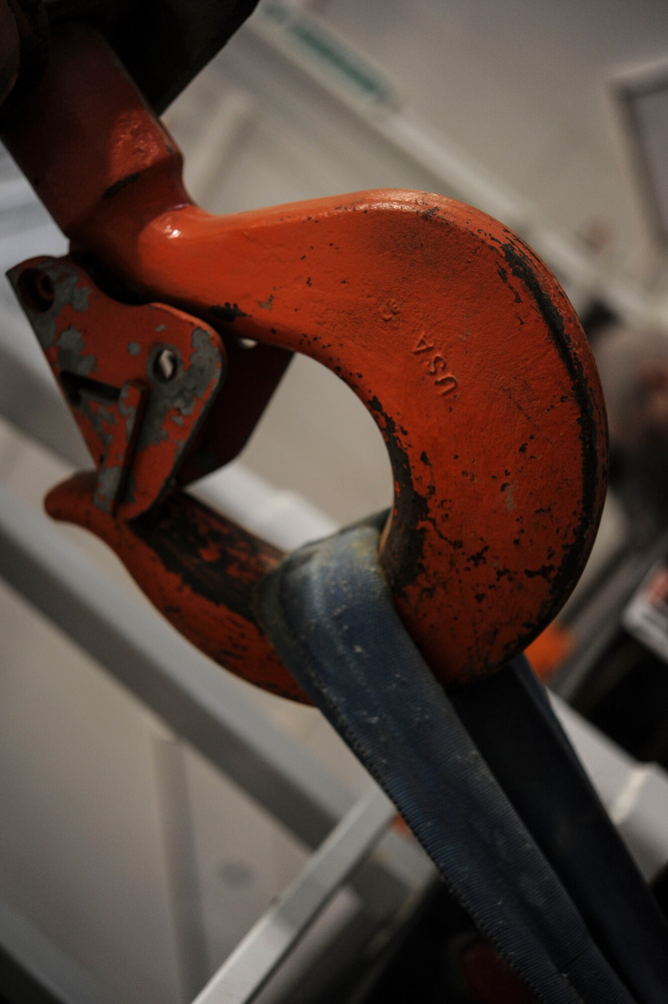 A crane hook hangs in the maintenance bay of the 91st Missile Wing mechanical and pneudraulics section on Minot Air Force Base, N.D. Oct. 30, 2014. MAPS recently split into two separate shops; MAPS and the system survivability team. (U.S. Air Force photo/Senior Airman Stephanie Morris)