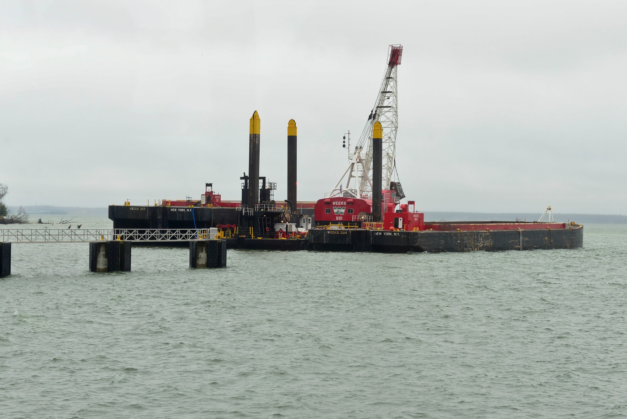 A mechanical dredge sits near 3rd Port at Fort Eustis, Va., Dec. 9, 2014. The dredge is being used to help remove material that got deposited in the channel over 10 years. (U.S. Air Force photo by Senior Airman Kimberly Nagle/Released)