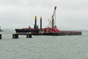 A mechanical dredge sits near 3rd Port at Fort Eustis, Va., Dec. 9, 2014. The dredge is being used to help remove material that got deposited in the channel over 10 years. (U.S. Air Force photo by Senior Airman Kimberly Nagle/Released)