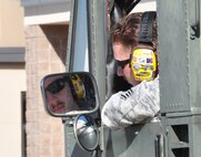 Staff Sgt. Andrew Anderson, 73rd Aerial Port Squadron ramp agent, checks his line of sight prior to training on a Tunner 60k aircraft cargo loader/transporter at Naval Air Station Fort Worth Joint Reserve Base, Texas, Dec. 6, 2014. The machine, borrowed from the 502nd Logistics Readiness Squadron, Joint Base San Antonio, Texas, and delivered on a 433rd Airlift Wing C-5, provided an historic opportunity for nearly 30 aerial port Airmen to receive crucial combat training requirements prior to a deployment. (U.S. Air Force photo by Master Sgt. Julie Briden-Garcia)