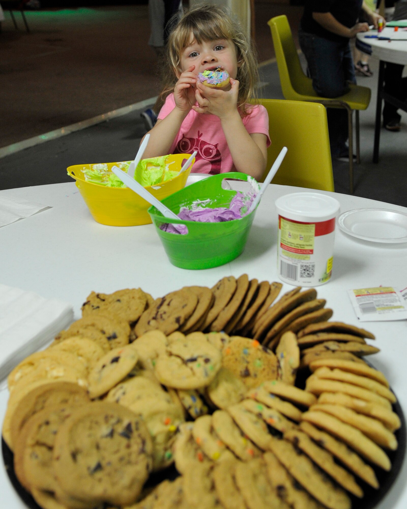 Madelyn Cantu, child of Capt. Gabriel Cantu, 325th Aerospace Medicine Squadron bioenvironmental engineer, bites from a decorated cookie Dec. 5 at the Hearts Apart Who-liday Party. The Hearts Apart event was organized by Tech. Sgt. Lloyd Estes, 325th Force Support Squadron, Airman and Family Readiness Center Noncommissioned Officer. (U.S. Air Force photo by Airman 1st Class Ty-Rico Lea)