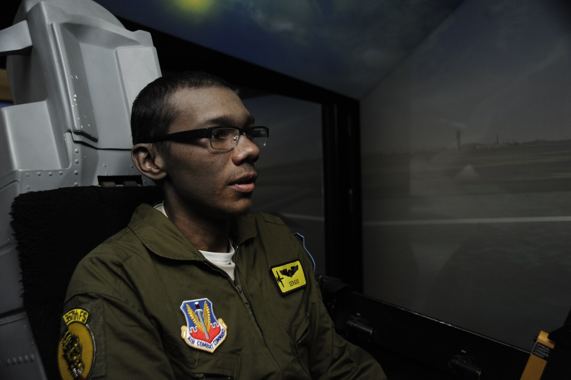 Sergio Quiroz, an honorary pilot with the 357th Fighter Squadron, flies an A-10C Thunderbolt II simulator during his Pilot for a Day program tour at Davis-Monthan Air Force Base, Ariz., Dec. 4, 2014. The Pilot for a Day program invites local young individuals battling severe illnesses and conditions to be a guest of the 355th Fighter Wing and one of D-M's flying squadrons for an entire day. (U.S. Air Force photo by Airman 1st Class Betty R. Chevalier)