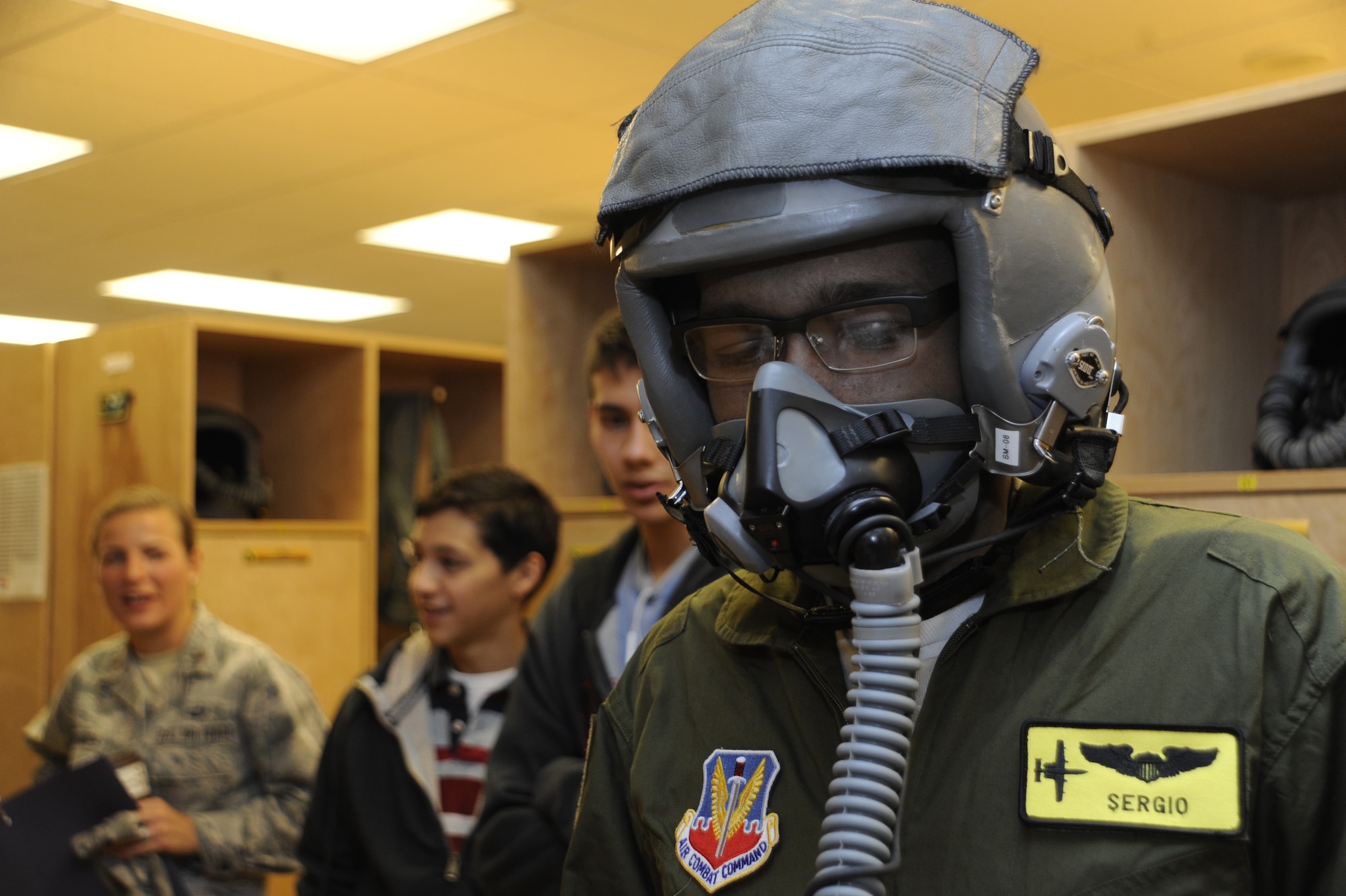Sergio Quiroz, an honorary pilot for the 357th Fighter Squadron, tests out an oxygen mask during the Pilot for a Day program at Davis-Monthan Air Force Base, Ariz., Dec. 4, 2014. During the visit, Quiroz was inducted into the 357th FS where him and his cousins tried on pilot flight equipment, visited the A-10 and parachute simulators and toured the air traffic control tower. (U.S. Air Force photo by Airman 1st Class Betty R. Chevalier)