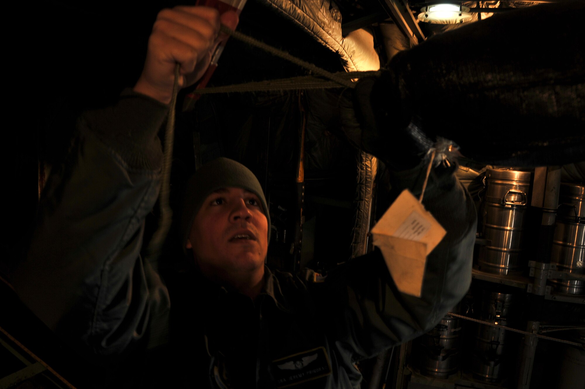 A C-130 Hercules is prepared for a tactical drop training flight by members of the 911th Aircraft Maintenance Squadron, the 911th Operations Support Squadron and the 758th Airlift Squadron during subzero weather at Pittsburgh International Airport Air Reserve Station, Jan. 22, 2014. During the winter months, aircraft must go through many steps before it is ready to fly. These steps include being towed from their parked location to a de-icing pad, heating the engines to ensure the propellers aren’t frozen in place, and then the normal preflight inspections and equipment loading. (U.S. Air Force illustration photo by Senior Airman Joshua J. Seybert)