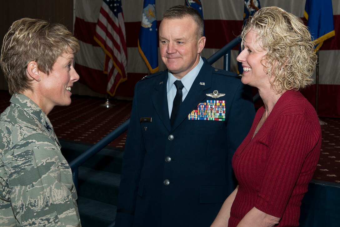 U.S. Air Force Col. Bruce Cox, 307th Bomb Wing commander, and his wife Wanda, are congratulated by Col. Kristen Goodwin, 2nd Bomb Wing commander, following a 307th Bomb Wing Change of Command Ceremony, Dec. 7, 2014, Barksdale Air Force Base, La. Cox, is the former Director of Operations and Plans Directorate, 10th Air Force, Naval Air Station Joint Reserve Base Fort Worth, Texas. (U.S. Air Force photo by Master Sgt. Greg Steele/Released)