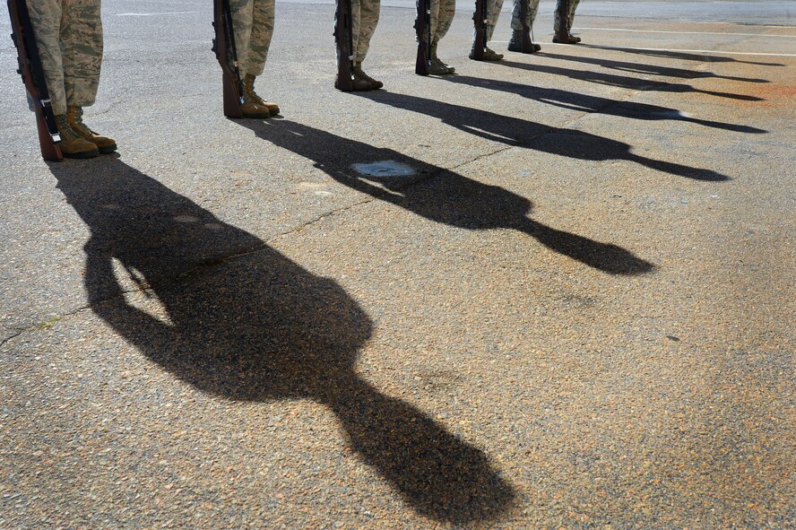 U.S. Air Force Airmen assigned to the 20th Force Support Squadron honor guard, practice a 3-volley rifle salute at Shaw Air Force Base, S.C., Dec. 10, 2014. During their six-month commitment to the honor guard, Airmen spend several weeks learning various drill movements that they will perform at official military ceremonies. (U.S. Air Force photo by Airman 1st Class Jensen Stidham/Released)